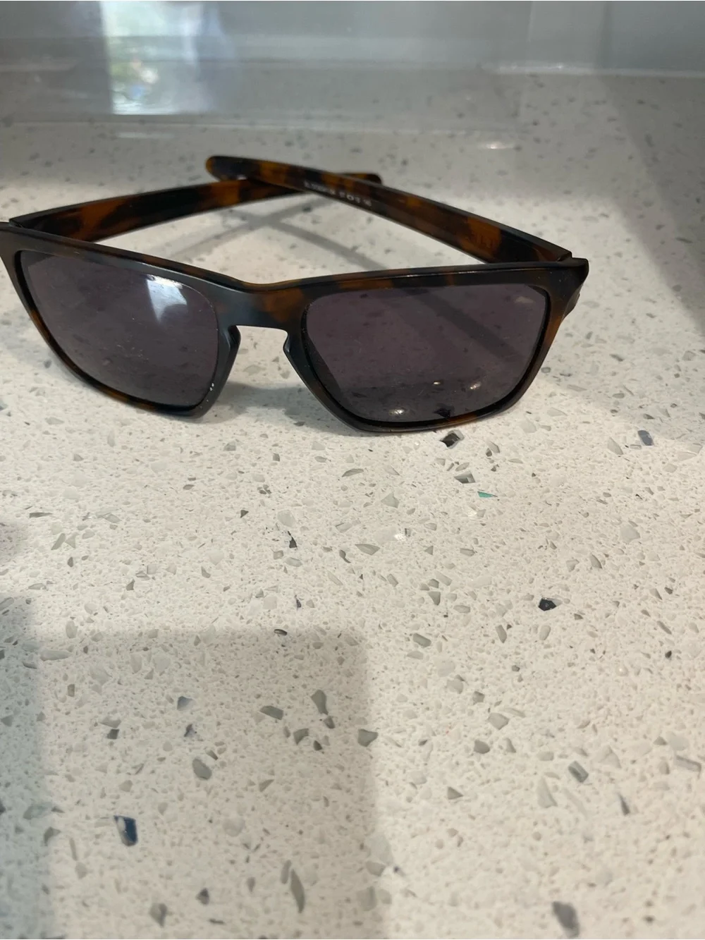 Oakley Tortoise Shell Sunglasses with Dark Gray Lenses